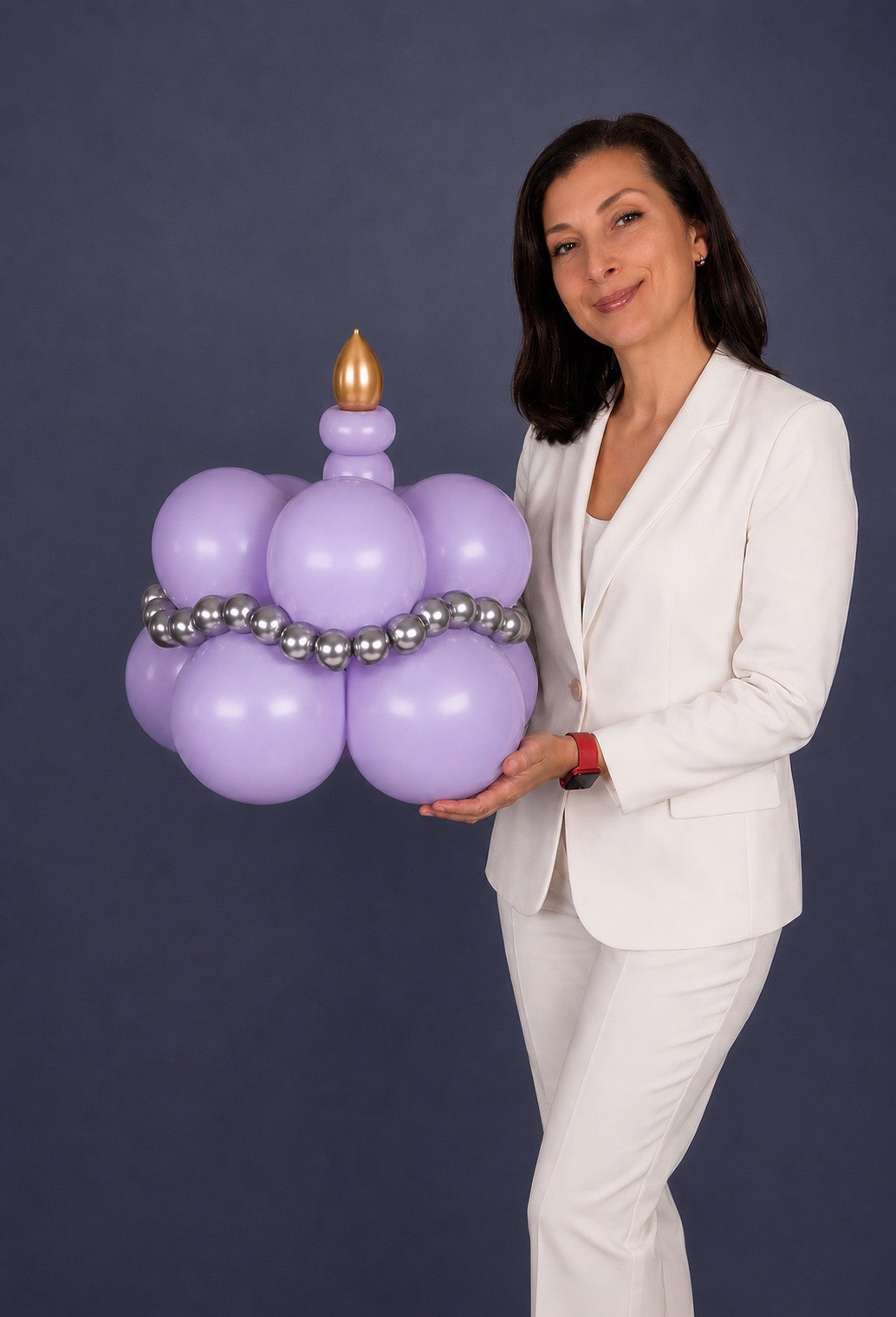 Placeholder portrait of Oksana Hrapko in a light look beside minimal balloon decor